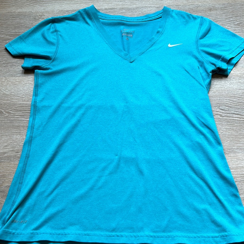 Light blue women’s Nike dri- fit top